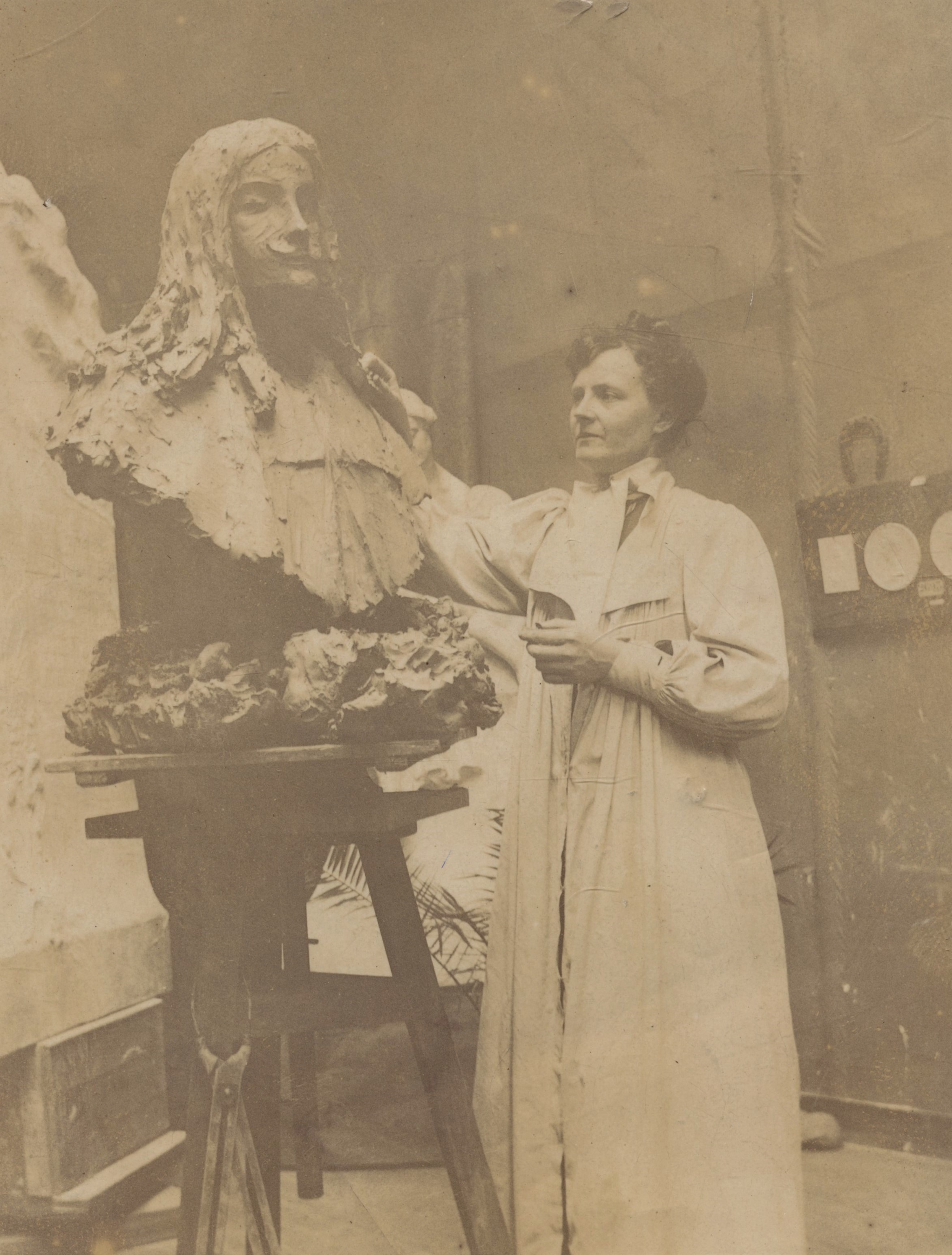 Ida Matton at work on her bust of Molière. Photographer and date unknown. Uppsala University Library (6690)